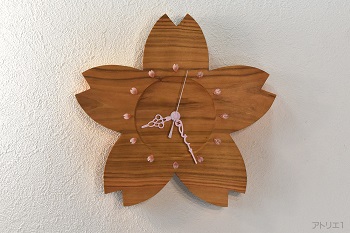 桜を桜の花びらの形に切り出した掛け時計です。